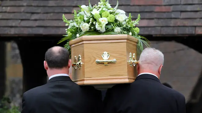A coffin being carried