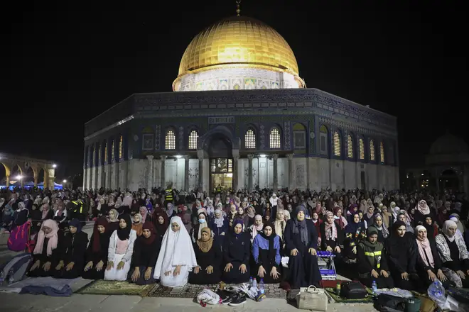 Palestinian Muslim worshippers pray during the Laylat al-Qadr, or the night of destiny, at the Al Aqsa Mosque compound.