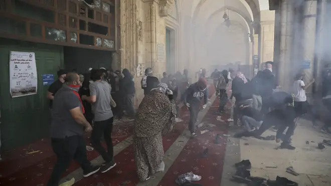 Israeli Police fired stun grenades and tear gas at protesters and worshippers inside Al-Aqsa Mosque