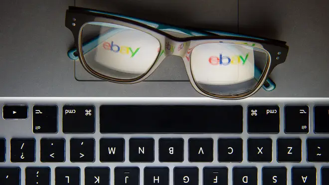 The logo of internet auction site eBay reflected in a pair of glasses