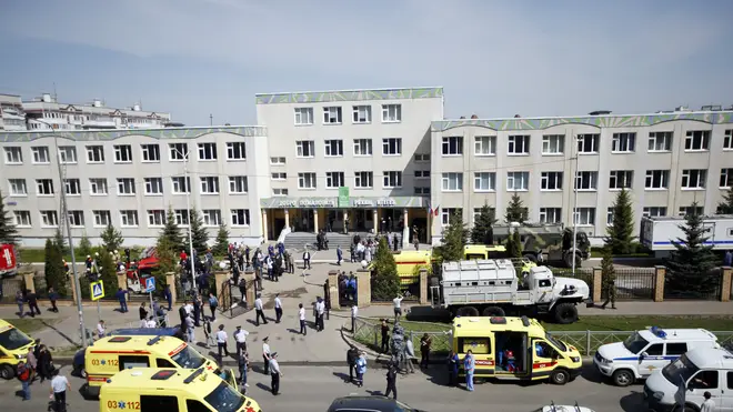 Ambulances and police cars at a school after a shooting in Kazan, Russia