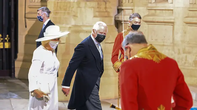 Her Majesty was accompanied by her son the Prince of Wales and his wife the Duchess of Cornwall, who each wore facemasks