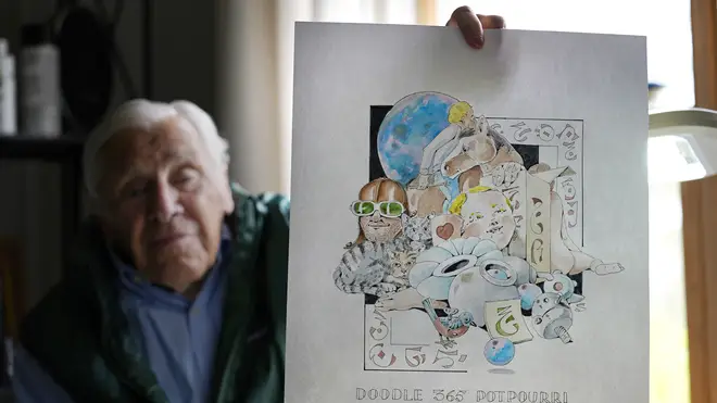 Artist Robert Seaman holds up the 365th daily doodle sketch in his room at an assisted living facility in Westmoreland, New Hampshire