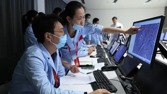 Technical personnel work at the Beijing Aerospace Control Center