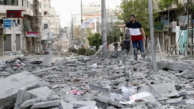A man stands amid the rubble following an Israeli air strike in Gaza City