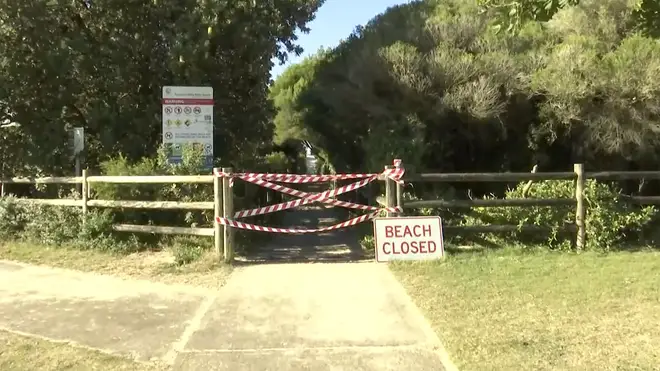 A beach closed sign in Tuncurry, Australia
