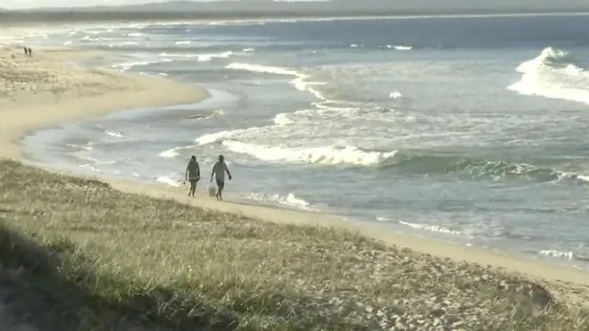 Image from a video shot on a nearby beach to where the man was attacked by a shark