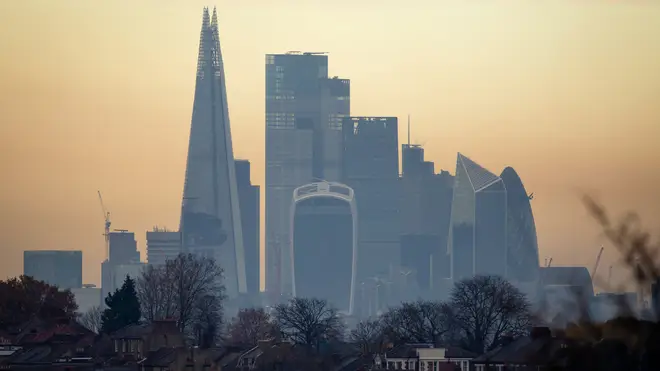 A view of the City of London surrounded by haze