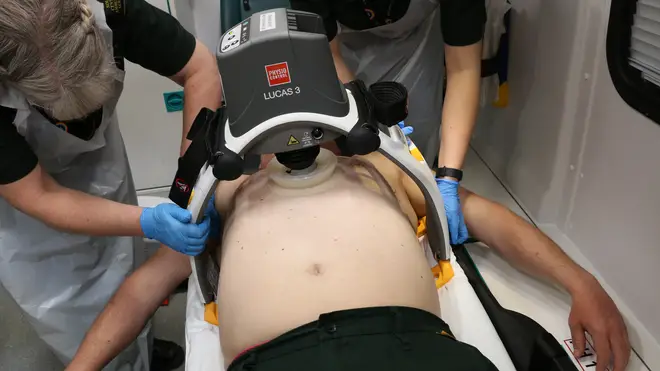 A 'robot paramedic' carries out chest compressions on a patient in an ambulance