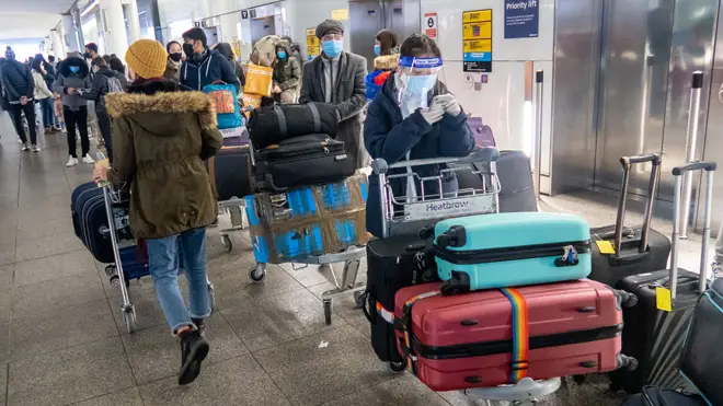 Passengers queue at Heathrow airport (file image)