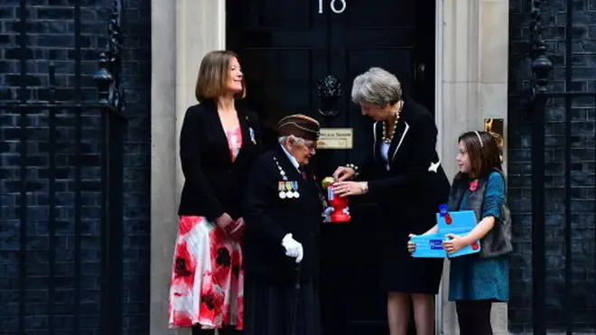 Theresa May and Royal British Legion volunteers