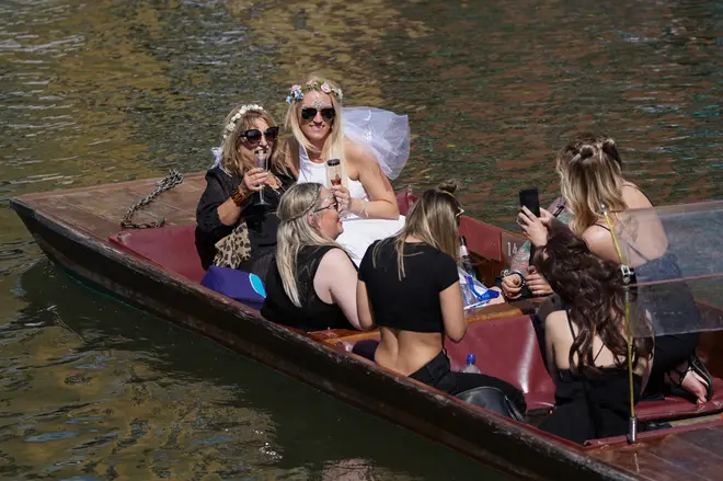Visitors enjoyed special occasions on punts in Cambridge as the city heated up on Saturday