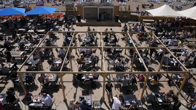 People packed Brighton's seafront yesterday enjoying new freedoms in the sunshine after lockdown measures were eased