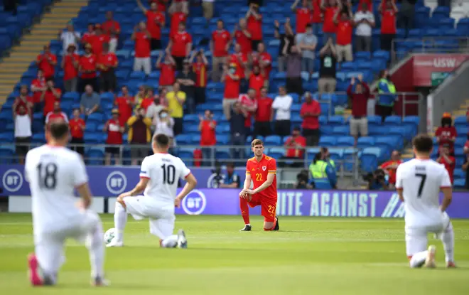 Wales' Chris Mepham takes the knee prior to their game against Albania on Saturday.
