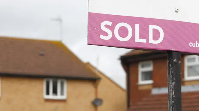 A sold sign outside houses
