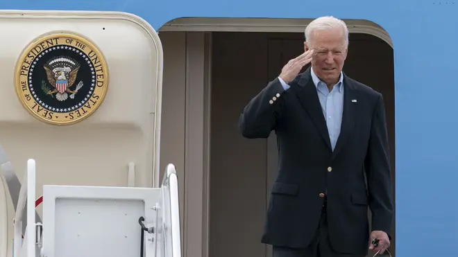 President Joe Biden salutes as he boards Air Force One (Alex Brandon/AP)
