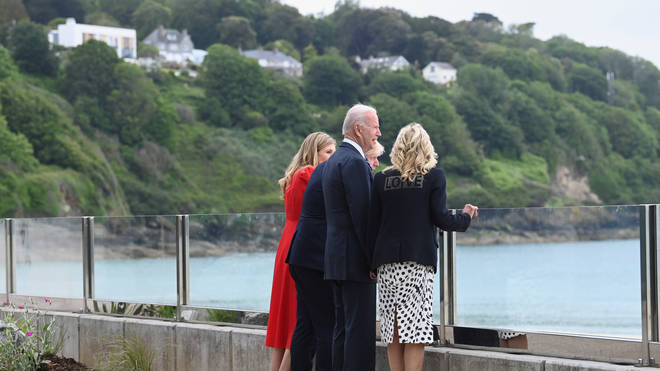 The four stopped to admire the view, with Mr Biden calling it "gorgeous"