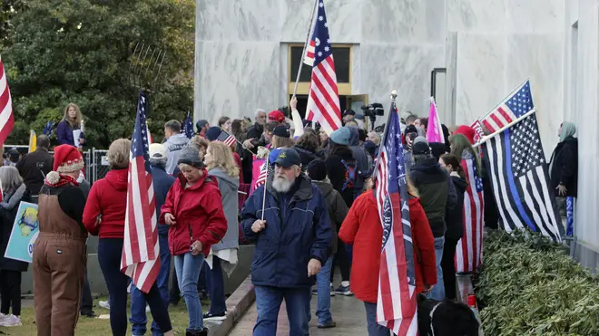 Pro-Trump and anti-mask demonstrators hold a rally outside the Oregon State Capitol last December