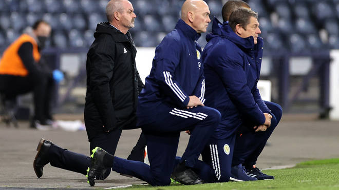 Scotland manager Steve Clarke (left) takes a knee in support of the Black Lives Matter movement before the UEFA Nations League game last year