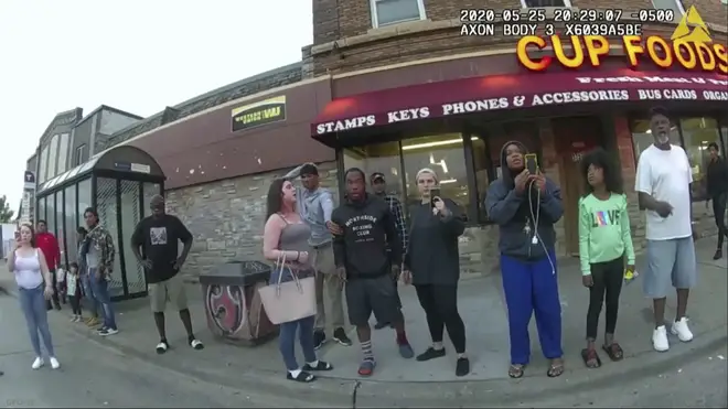 Bystanders including Darnella Frazier, third from right filming, as Derek Chauvin pressed his knee on George Floyd’s neck