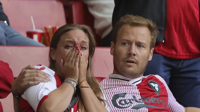 Distraught fans looked on as Eriksen received treatment