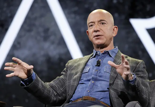 Jeff Bezos and his brother will fly into space in July with the mystery bidder