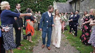 Mr and Mrs Bone, Lucy and James, pictured at their wedding in May with 30 people present