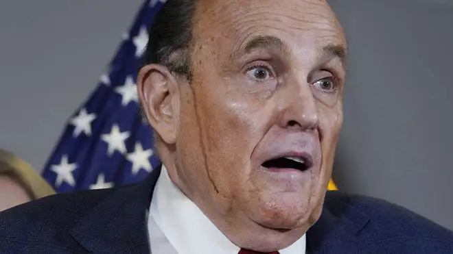 Rudy Giuliani's hair dye stole the show at one press conference after it melted in streaks down his face.
