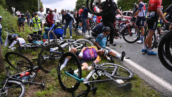 Cyclists were left battered and bruised by a major crashed caused by a fan's sign