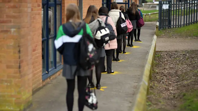Pupils queuing to take a lateral flow test at Archway School in Stroud in Gloucestershire
