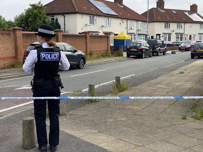 Police taped off a residential street in Huyton after the shooting