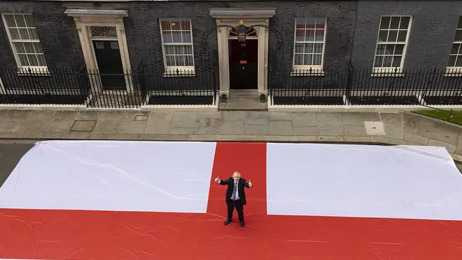 Boris Johnson posed with a giant England flag outside Downing Street