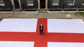 Boris Johnson posed with a giant England flag outside Downing Street