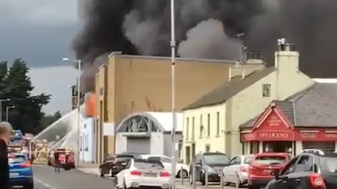 A building became engulfed in a fiery inferno amid reports it was struck by lightning