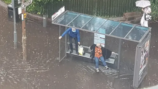 A couple were caught out in the rain