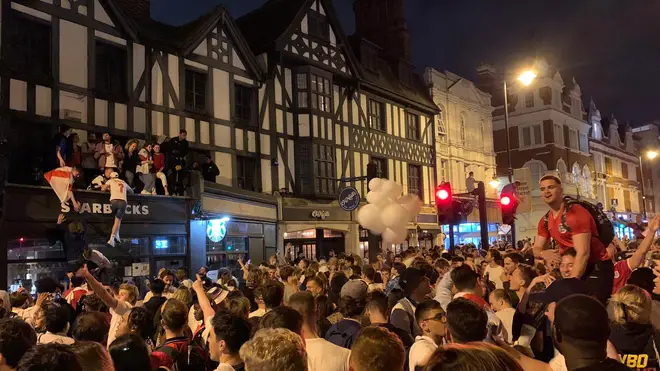 Fans celebrate in Clapham, London