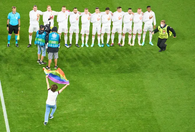 A person with a rainbow flag demonstrated when the Hungary national team played at Euro 2020
