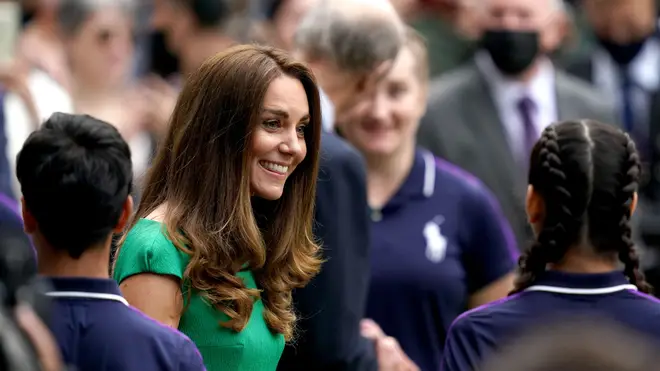 Kate speaks with ball boys and girls during the presentation