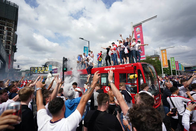 Fans climbed on top of a bus outside Wembley on Sunday morning.