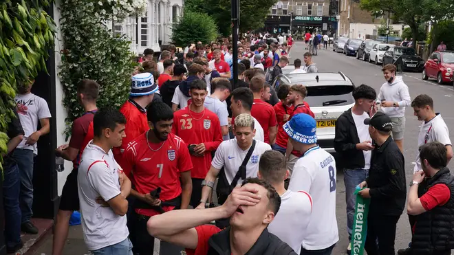 Crowds queued outside The Faltering Fullback in Finsbury Park hoping to find a seat to watch the game.