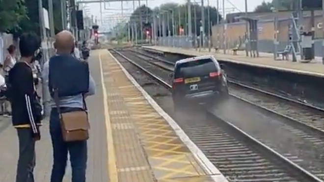 The car was videoed heading down train tracks
