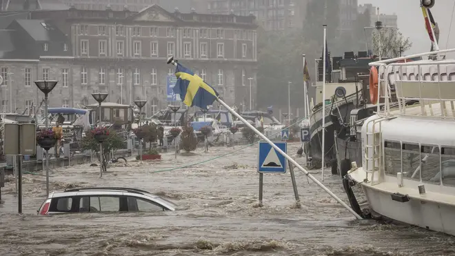 Cars have been submerged in the heavy flooding in Liege, Belgium.