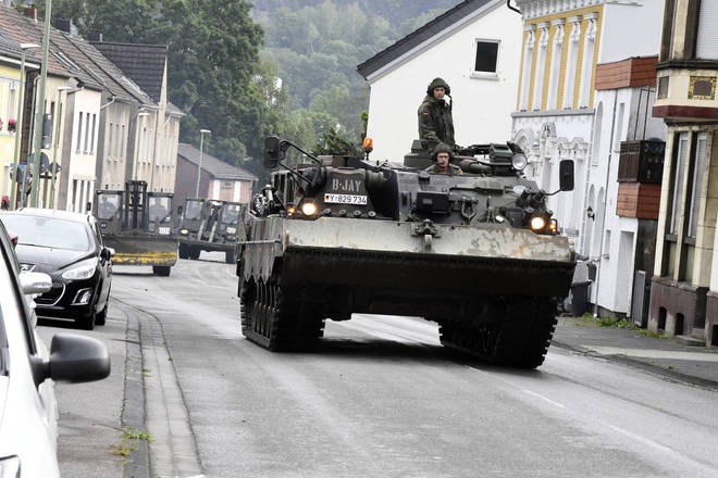 The German army have deployed tanks to help clear roads.