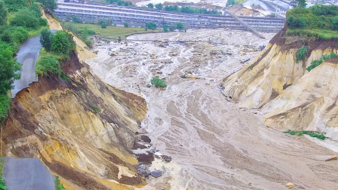 On Thursday, the floodwaters of the Inde River overflowed a dike and flowed into the Inden opencast mine in North Rhine-Westphalia.