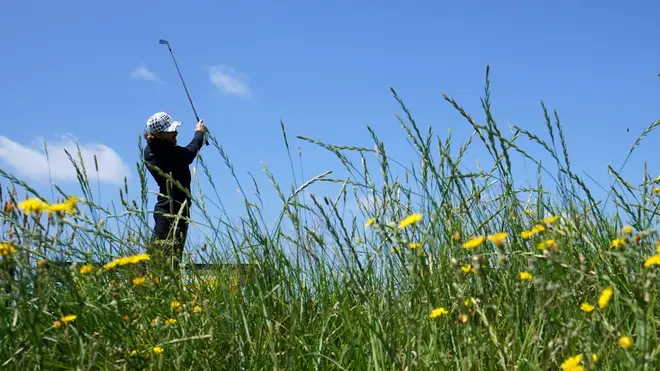 England's Tommy Fleetwood teeing off under blue skies at The Open