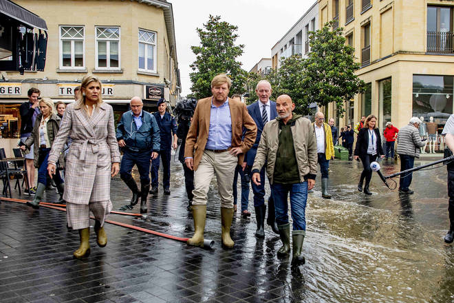 King Willem-Alexander of The Netherlands and Queen Maxima of The Netherlands inspect the damage caused by extreme flooding in Valkenburg.