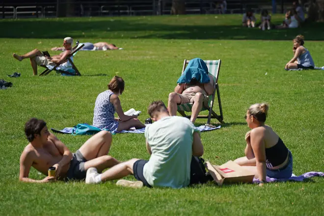 Sunbathers flocked to St James Park in London