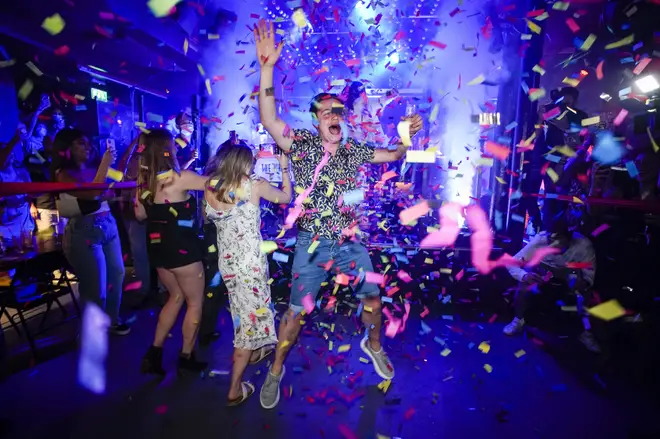 People celebrated the reopening of nightclubs at midnight.