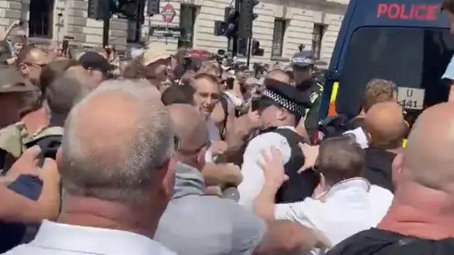 Protesters and police scuffled with each other in heated scenes at Parliament Square
