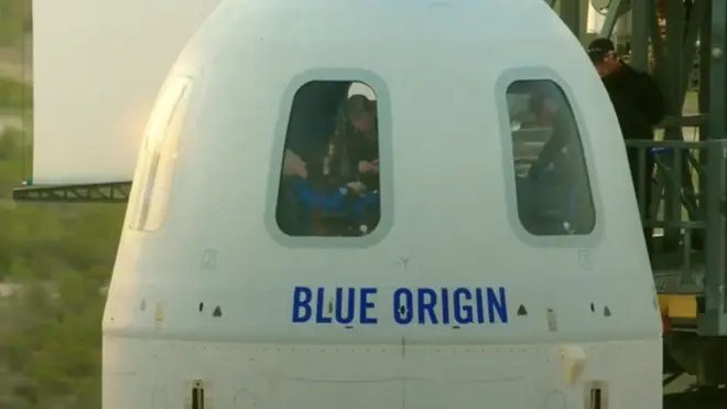 The crew could be seen inside the capsule before they took off.